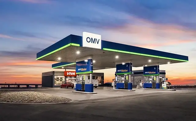 OMV gas station with VIVA shop at sunset.