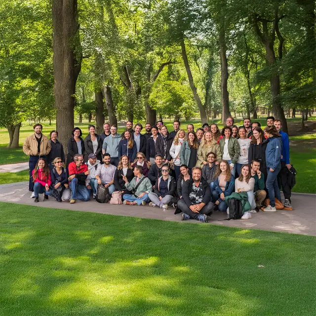 Group photo of marketmind in a park during the Copenhagen team trip in 2023.