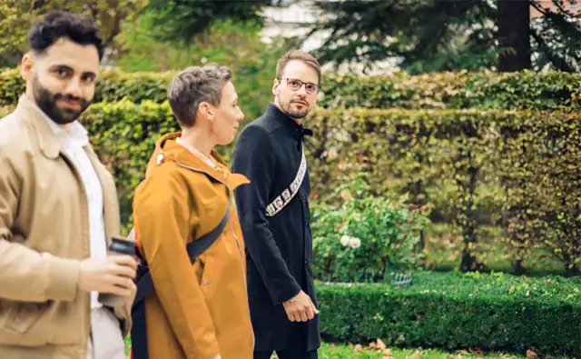 Daniel Winzer, Dagmar Jiresch, and Youssef Kawmi on their way to the marketmind office through Liechtenstein Park.