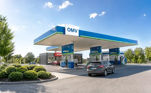 OMV gas station with VIVA shop at sunset.