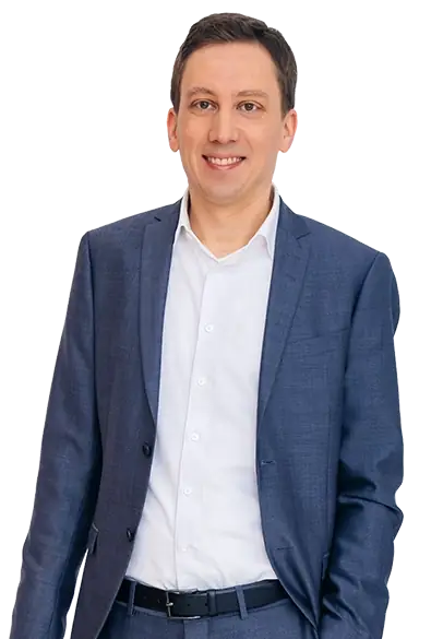 Portrait of Thomas Schuster in business attire