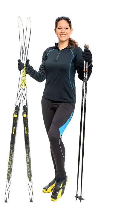Anita Schmidt-Pöstion is equipped in cross-country skiing gear with skis and poles - ready for athletic adventures in the snow.