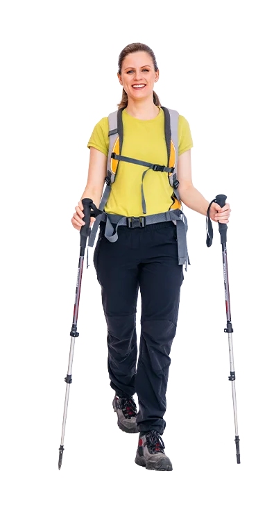 Katharina Posch, PhD is on the way with hiking poles and backpack, wears functional outdoor clothing - athletic, active, and perfectly equipped for the mountains.