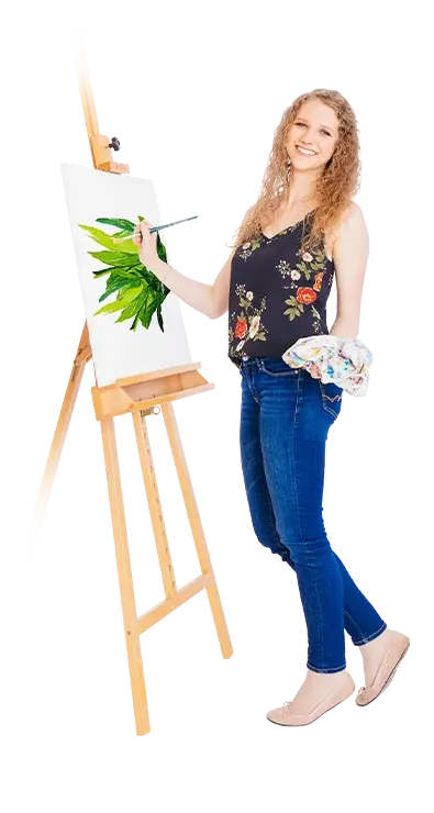 Sophie Buchta stands in front of an easel and paints green plants on a canvas, cloth in hand - nature-connected, cheerful, and full of creativity.